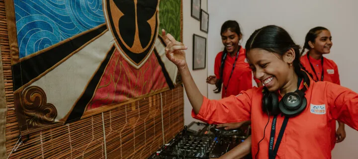 Tomorrowland Foundation - A girl playing dj